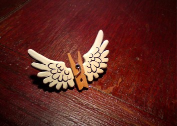 Pegasus broach in resin and wood.